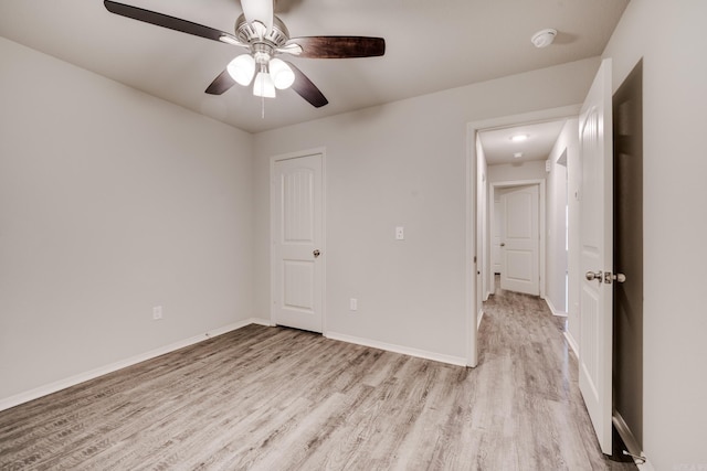 1375 Lacroix Ln, Conway, AR 72034 - spare room featuring light wood-style floors, a ceiling fan, and a smoke detector