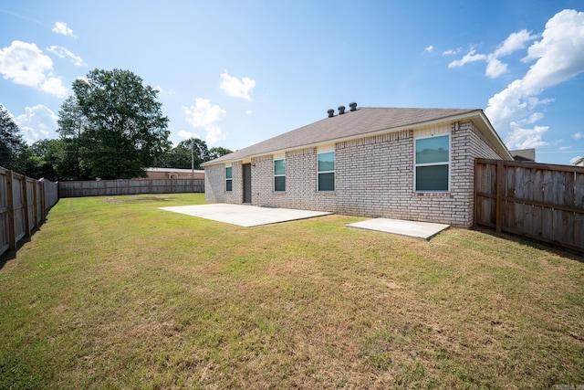 1375 Lacroix Ln, Conway, AR 72034 - back of property featuring a patio area, brick siding, and a fenced backyard