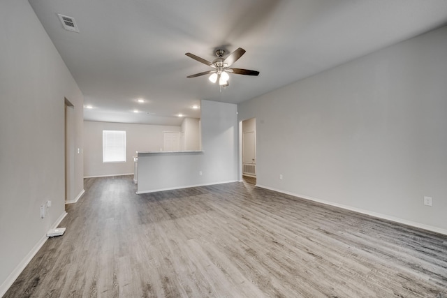 1375 Lacroix Ln, Conway, AR 72034 - unfurnished living room featuring ceiling fan, wood finished floors, and recessed lighting