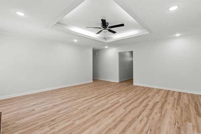 120 Whitewood Dr, Sherwood, AR 72120 - empty room featuring a tray ceiling, recessed lighting, ceiling fan, and light wood finished floors