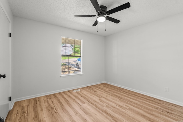 120 Whitewood Dr, Sherwood, AR 72120 - spare room with light wood-type flooring, a textured ceiling, and a ceiling fan