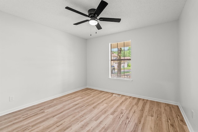120 Whitewood Dr, Sherwood, AR 72120 - spare room featuring wood finished floors, a textured ceiling, and ceiling fan