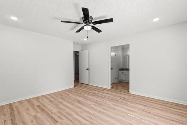 120 Whitewood Dr, Sherwood, AR 72120 - empty room with light wood finished floors, ceiling fan, recessed lighting, and a textured ceiling