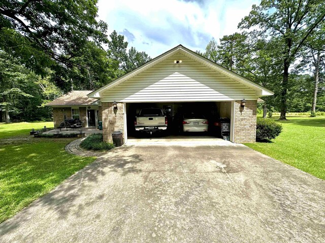6823 Nevins Rd, Pine Bluff, AR 71603 - view of home's exterior featuring brick siding and a yard