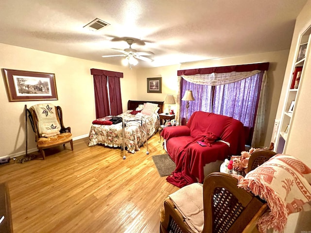 6823 Nevins Rd, Pine Bluff, AR 71603 - bedroom featuring wood finished floors and a ceiling fan