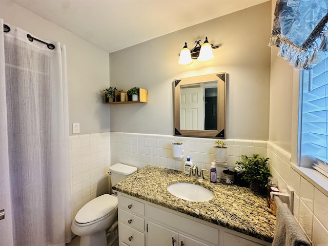 1912 W Arch Ave, Searcy, AR 72143 - bathroom with vanity, tile walls, wainscoting, and curtained shower