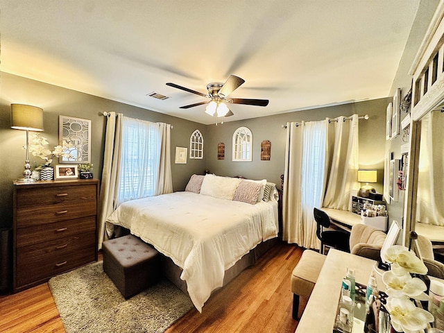 1912 W Arch Ave, Searcy, AR 72143 - bedroom with wood finished floors and a ceiling fan