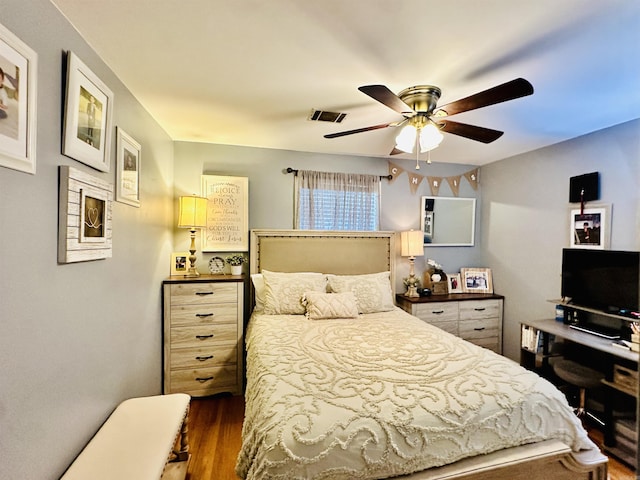 1912 W Arch Ave, Searcy, AR 72143 - bedroom with dark wood-style flooring and ceiling fan