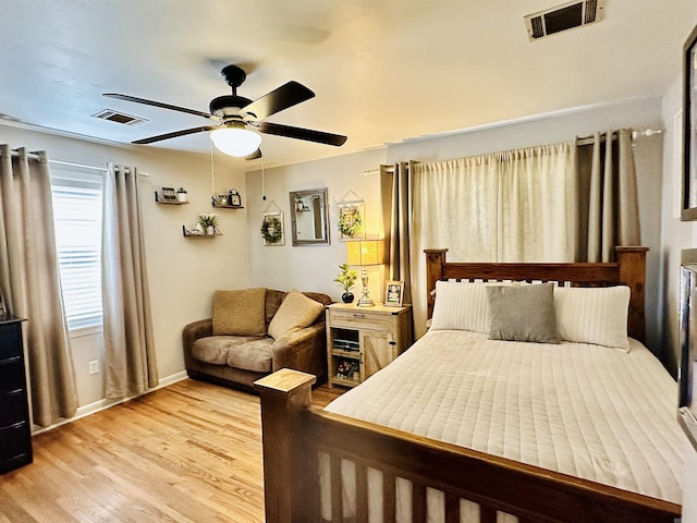 1912 W Arch Ave, Searcy, AR 72143 - bedroom with light wood-style flooring and ceiling fan