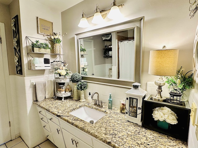 1912 W Arch Ave, Searcy, AR 72143 - full bathroom with vanity, backsplash, and tile patterned floors