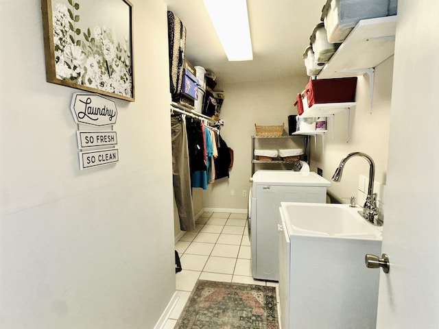 1912 W Arch Ave, Searcy, AR 72143 - laundry room featuring washing machine and dryer and light tile patterned floors