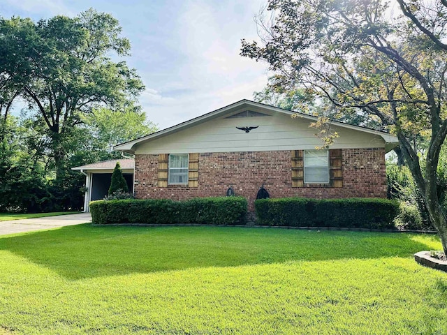 1912 W Arch Ave, Searcy, AR 72143 - view of property exterior with a yard, driveway, and brick siding
