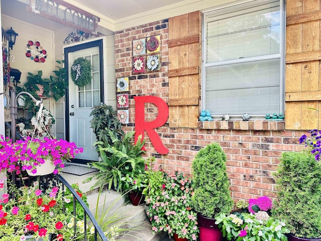 1912 W Arch Ave, Searcy, AR 72143 - doorway to property featuring brick siding and a porch