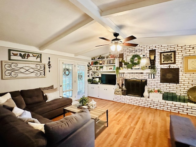 1912 W Arch Ave, Searcy, AR 72143 - living area with wood finished floors, a fireplace, and a ceiling fan