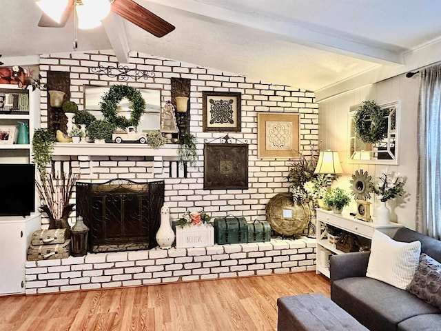 1912 W Arch Ave, Searcy, AR 72143 - living room with a fireplace, ceiling fan, and wood finished floors