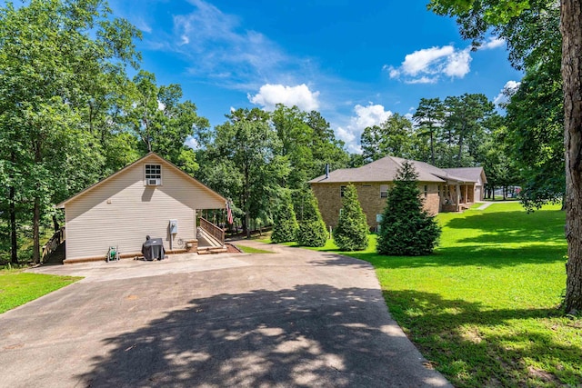 529 Charlie Stover, Royal, AR 71968 - view of home's exterior featuring stairs, a yard, and driveway