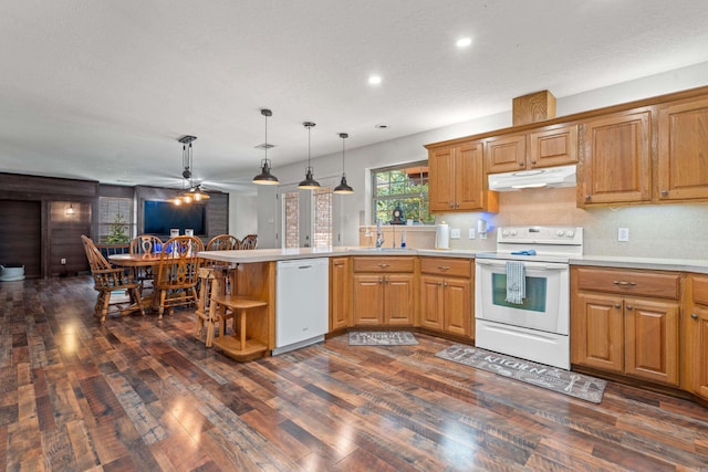 529 Charlie Stover, Royal, AR 71968 - kitchen with white appliances, under cabinet range hood, a peninsula, ceiling fan, and dark wood-type flooring