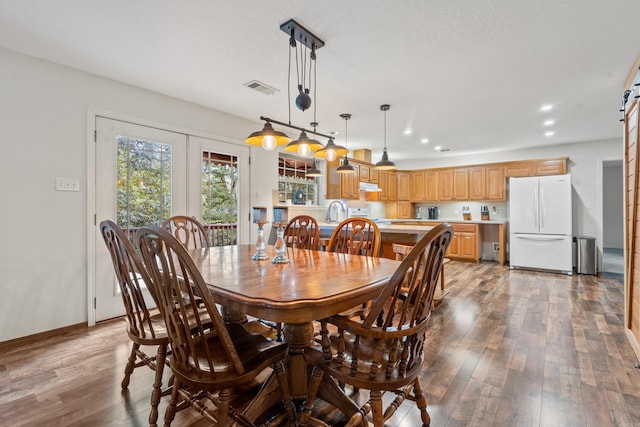 529 Charlie Stover, Royal, AR 71968 - dining room featuring dark wood-style floors, recessed lighting, and a barn door