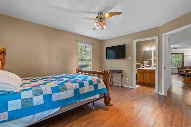 529 Charlie Stover, Royal, AR 71968 - bedroom with light wood finished floors, a ceiling fan, and connected bathroom