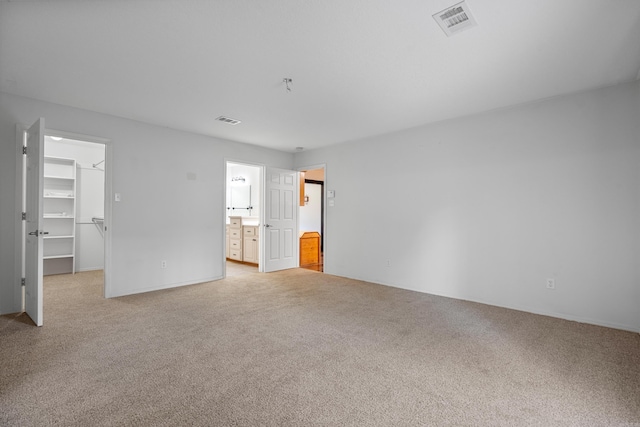 529 Charlie Stover, Royal, AR 71968 - unfurnished bedroom with light colored carpet, a walk in closet, a closet, and connected bathroom