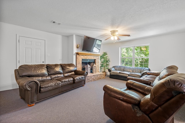 529 Charlie Stover, Royal, AR 71968 - carpeted living area featuring ceiling fan, a textured ceiling, and a fireplace