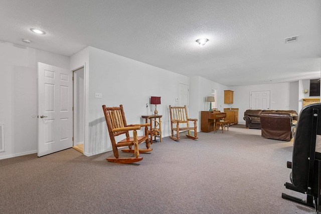 529 Charlie Stover, Royal, AR 71968 - living area featuring a textured ceiling and carpet