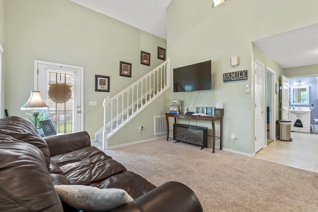 529 Charlie Stover, Royal, AR 71968 - carpeted living room featuring a high ceiling and stairs