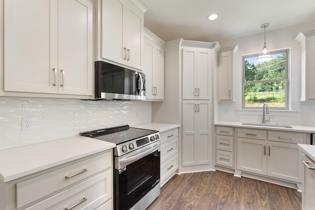 85 Lewis Loop, Greenbrier, AR 72058 - kitchen featuring appliances with stainless steel finishes, tasteful backsplash, light countertops, white cabinetry, and recessed lighting