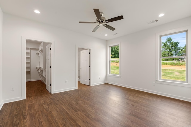 85 Lewis Loop, Greenbrier, AR 72058 - unfurnished bedroom with multiple windows, a spacious closet, dark wood-style flooring, a ceiling fan, and recessed lighting