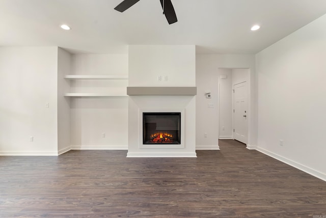 85 Lewis Loop, Greenbrier, AR 72058 - unfurnished living room featuring ceiling fan, dark wood-style flooring, a lit fireplace, and recessed lighting