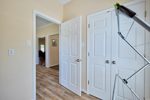 4116 Wildflower Ln, Benton, AR 72015 - corridor featuring crown molding and light wood finished floors