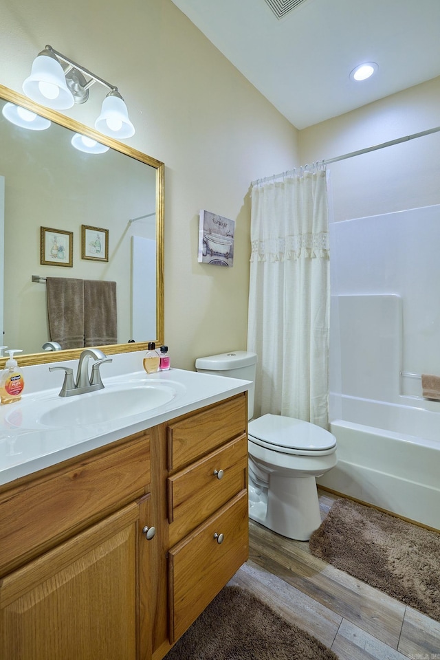 4116 Wildflower Ln, Benton, AR 72015 - bathroom with wood finished floors, vanity, and shower / bath combo with shower curtain