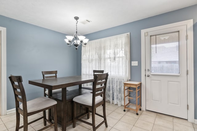 2225 Caleb Dr, Searcy, AR 72143 - dining area featuring healthy amount of natural light, a chandelier, and light tile patterned floors