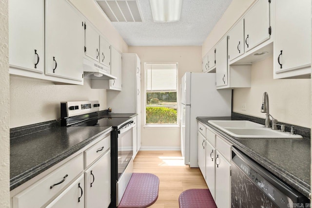 154 La Vista Ln, Hot Springs Village, AR 71909 - kitchen featuring stainless steel electric range oven, under cabinet range hood, dishwasher, dark countertops, and a textured ceiling