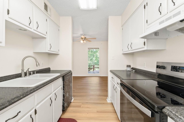 154 La Vista Ln, Hot Springs Village, AR 71909 - kitchen with stainless steel range with electric cooktop, under cabinet range hood, dark countertops, and light wood-type flooring