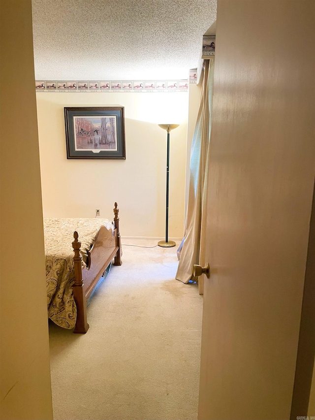 700 E 9th St Unit 6L, Little Rock, AR 72202 - carpeted bedroom featuring a textured ceiling