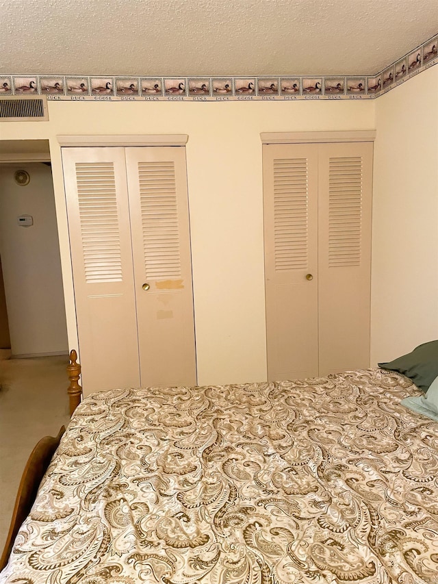 700 E 9th St Unit 6L, Little Rock, AR 72202 - bedroom with a textured ceiling