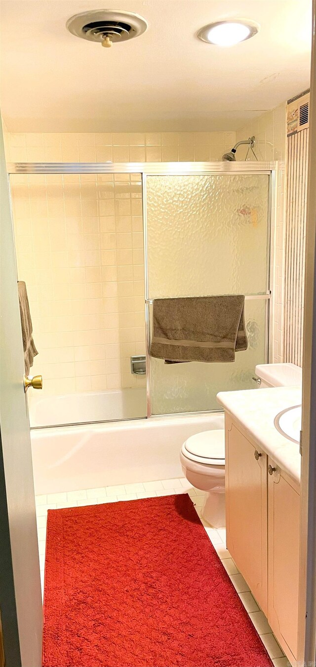700 E 9th St Unit 6L, Little Rock, AR 72202 - bathroom with tile patterned floors, vanity, and combined bath / shower with glass door