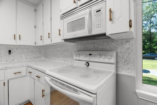 7616 Samples Rd, Benton, AR 72019 - kitchen featuring white appliances, healthy amount of natural light, white cabinetry, and wainscoting
