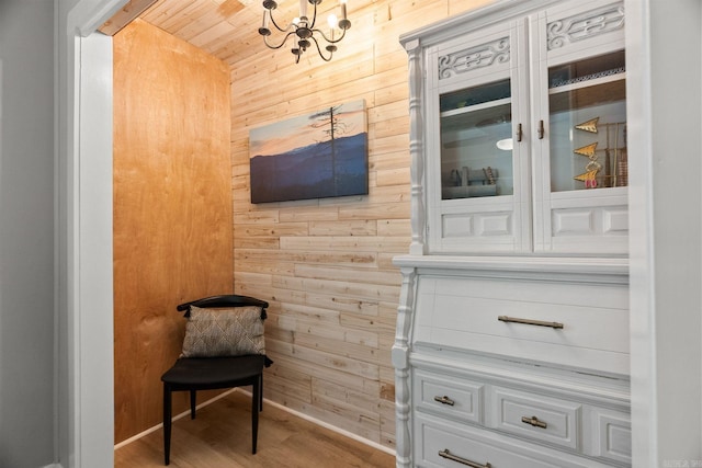 7616 Samples Rd, Benton, AR 72019 - living area with wood walls, a chandelier, and wood finished floors