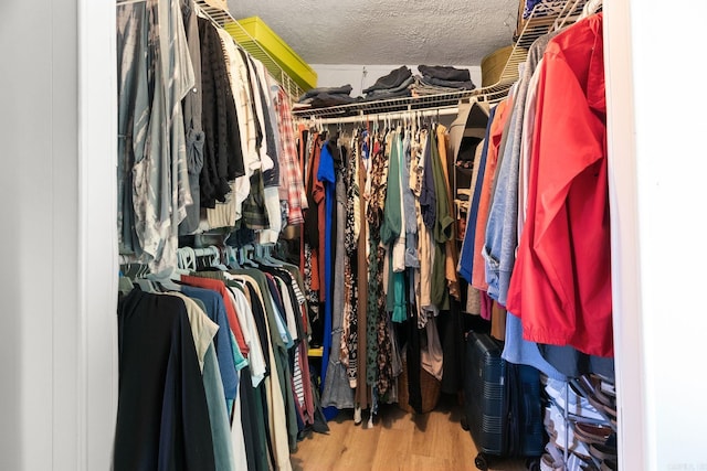 7616 Samples Rd, Benton, AR 72019 - spacious closet featuring wood finished floors