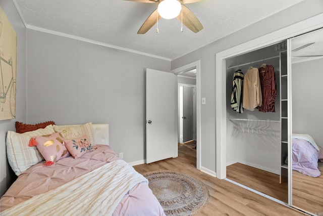 7616 Samples Rd, Benton, AR 72019 - bedroom featuring wood finished floors, a closet, ceiling fan, and a textured ceiling