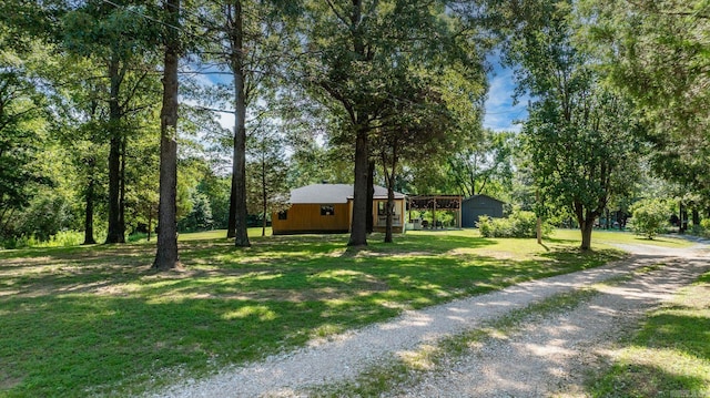 7616 Samples Rd, Benton, AR 72019 - view of grassy yard with driveway and a detached garage