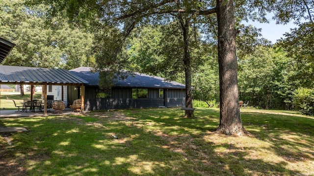 7616 Samples Rd, Benton, AR 72019 - view of green lawn featuring a patio