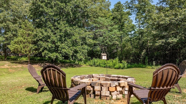 7616 Samples Rd, Benton, AR 72019 - view of grassy yard with an outdoor fire pit