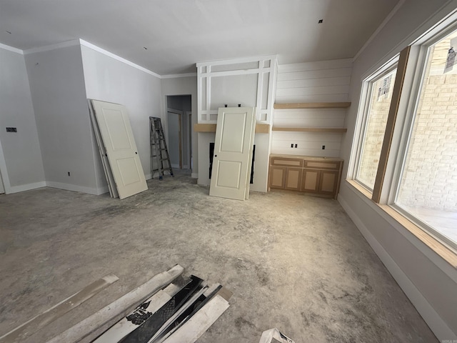 6960 Christine Ln, Benton, AR 72019 - unfurnished living room featuring plenty of natural light and ornamental molding