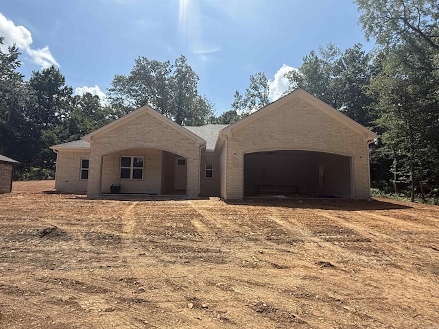 6960 Christine Ln, Benton, AR 72019 - view of front of house with brick siding, an attached garage, and driveway
