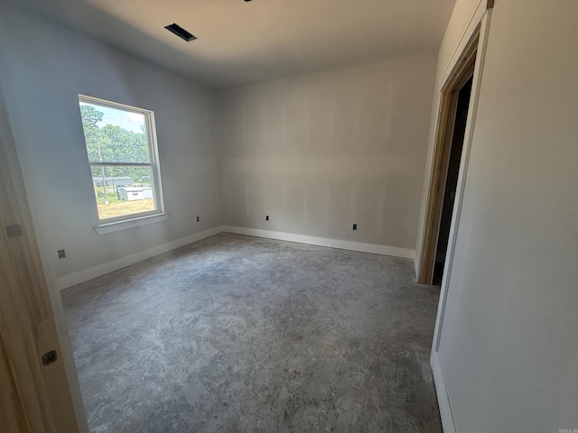 6960 Christine Ln, Benton, AR 72019 - unfurnished room with baseboards and concrete flooring