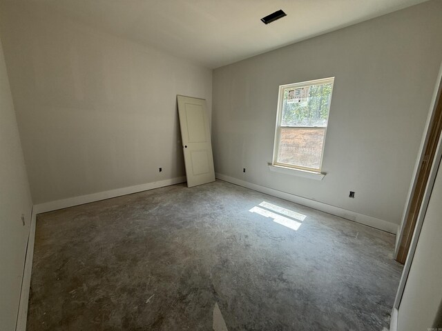 6960 Christine Ln, Benton, AR 72019 - unfurnished bedroom featuring concrete flooring