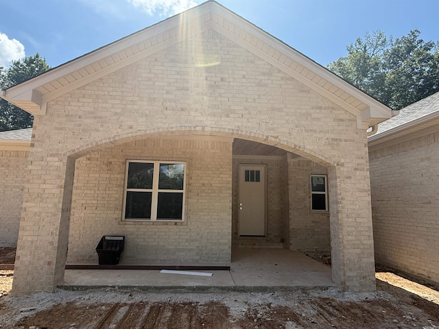 6960 Christine Ln, Benton, AR 72019 - rear view of property with brick siding and a patio area